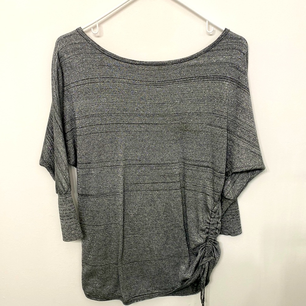 Gray/silver shirt. 3/4 fitted sleeves. Side tie. Length to hips.